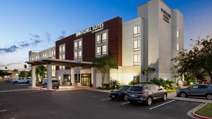A hotel with a modern design, featuring a prominent sign for Springhill Suites by Marriott. - SpringHill Suites by Marriott McAllen Convention Center (McAllen)