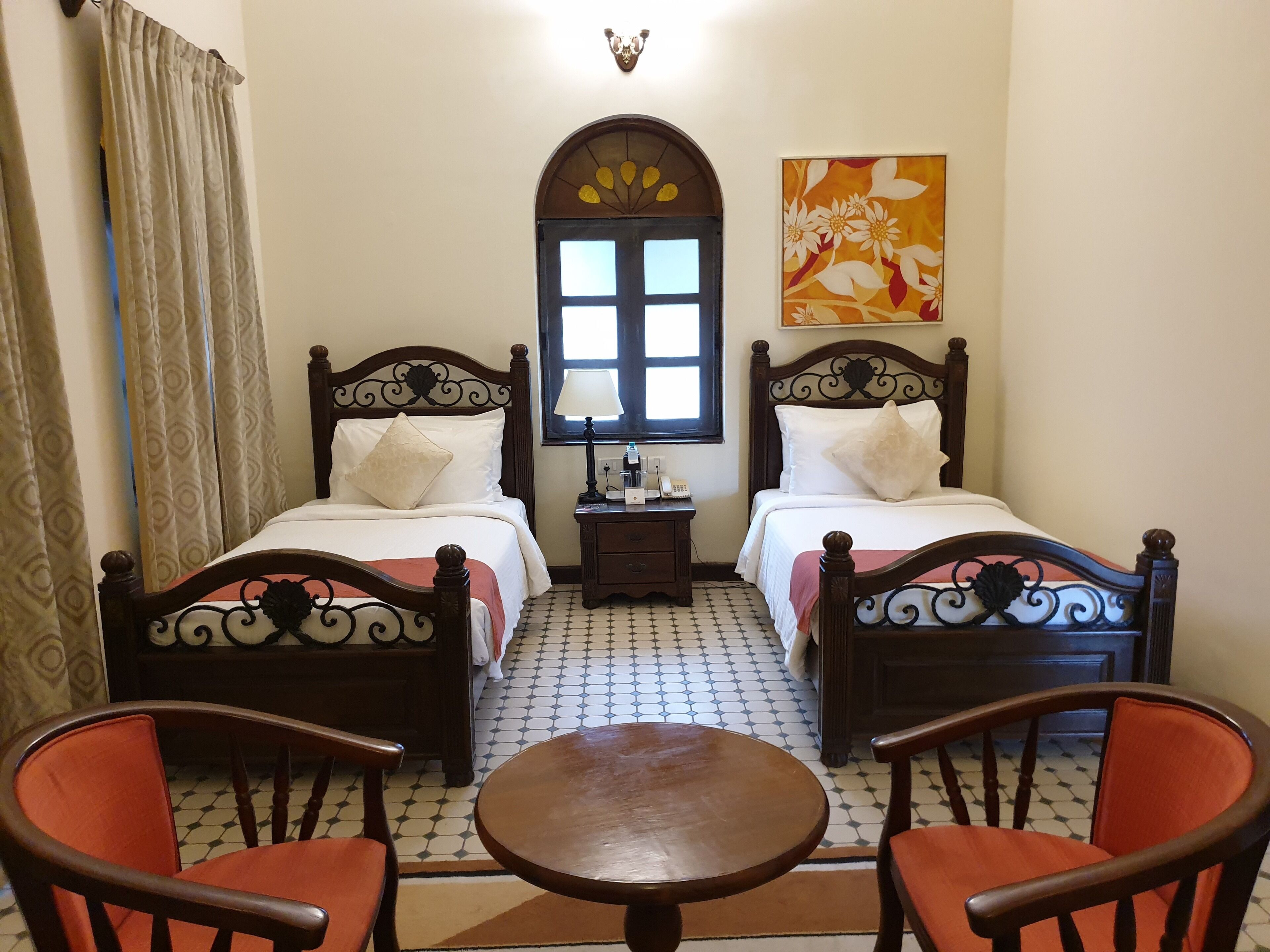 villa room with twin beds, cosy sitout area with garden views | living room | 55-inch smart tv with satellite channels, netflix, books