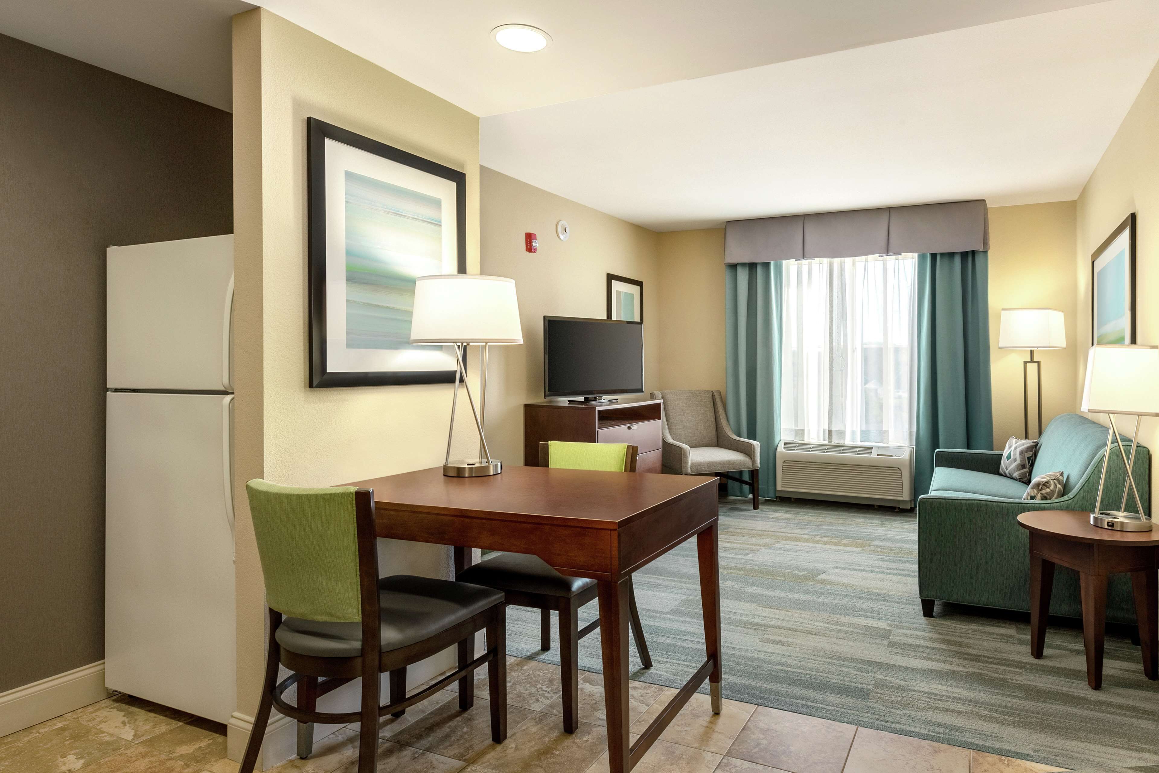 suite, 1 king bed, accessible (hearing) | in-room safe, desk, laptop workspace, iron/ironing board
