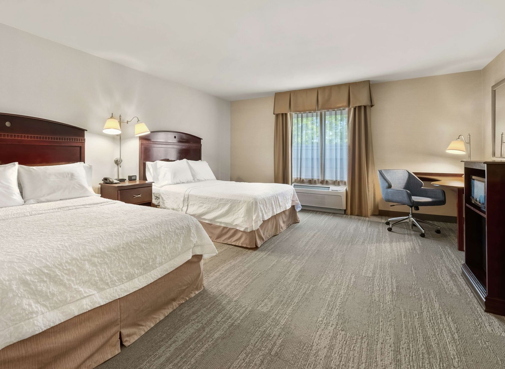 Hypo-allergenic bedding, desk, laptop workspace, blackout curtains