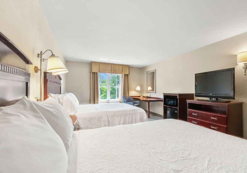 Hypo-allergenic bedding, desk, laptop workspace, blackout curtains