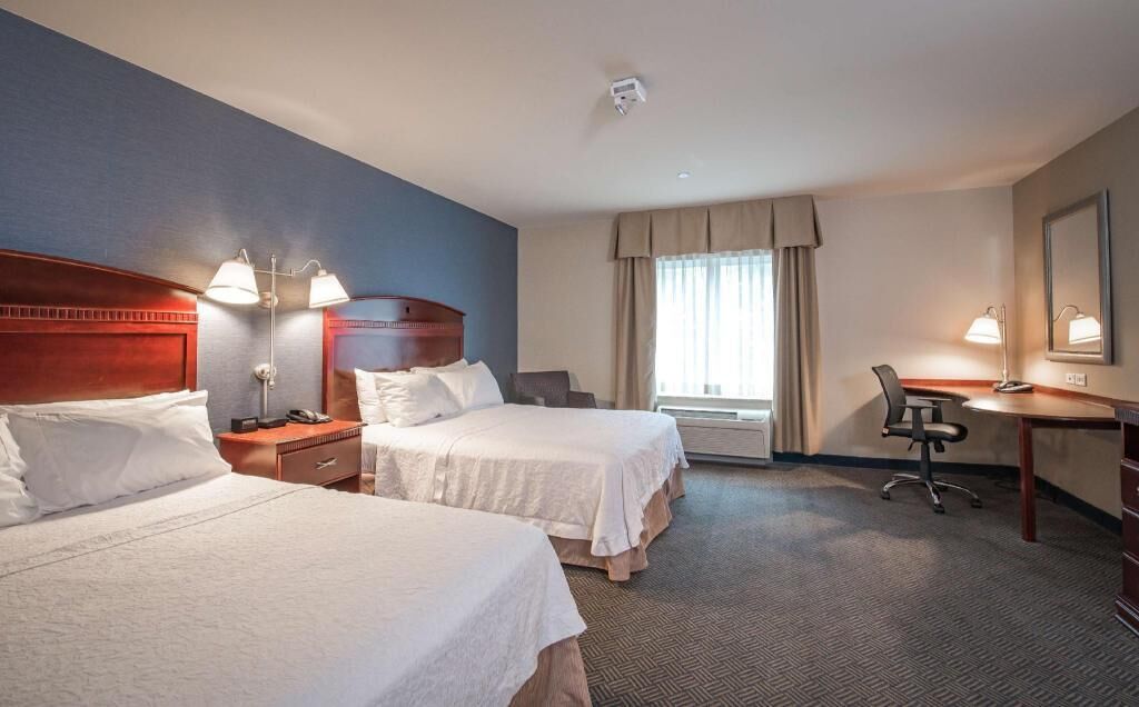 Hypo-allergenic bedding, desk, laptop workspace, blackout curtains