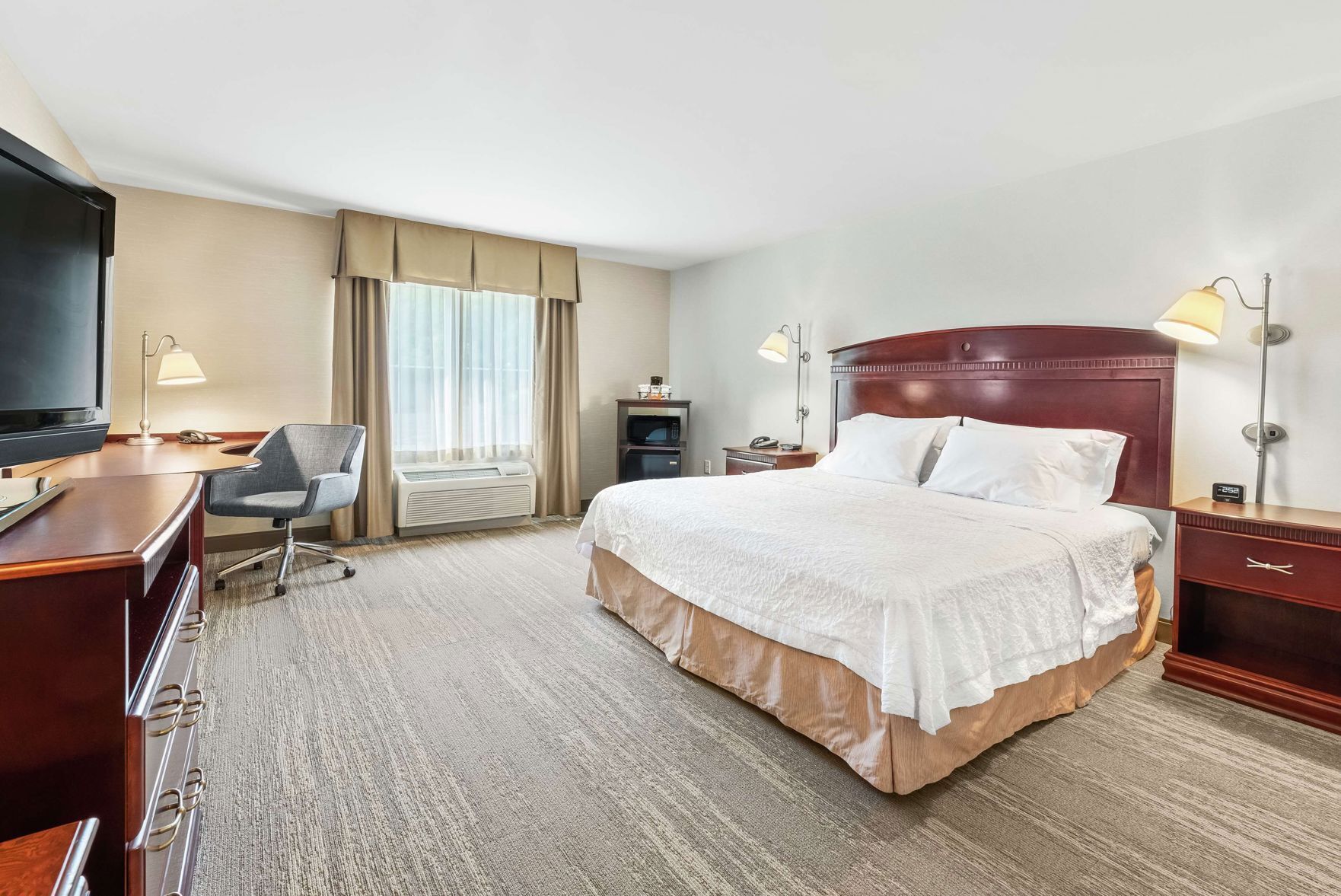 Hypo-allergenic bedding, desk, laptop workspace, blackout curtains