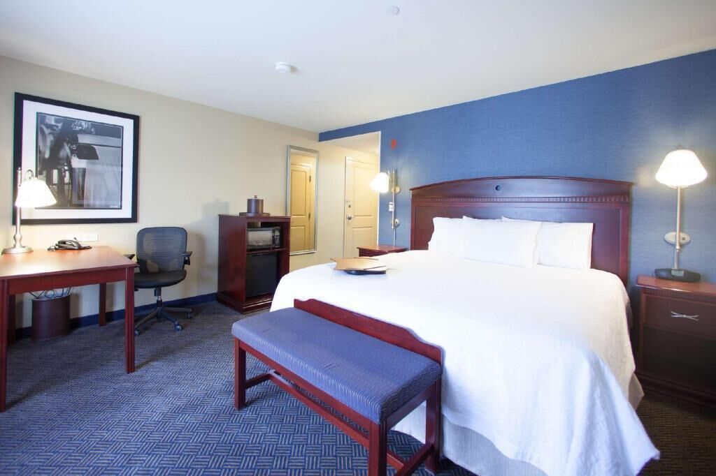 Hypo-allergenic bedding, desk, laptop workspace, blackout curtains