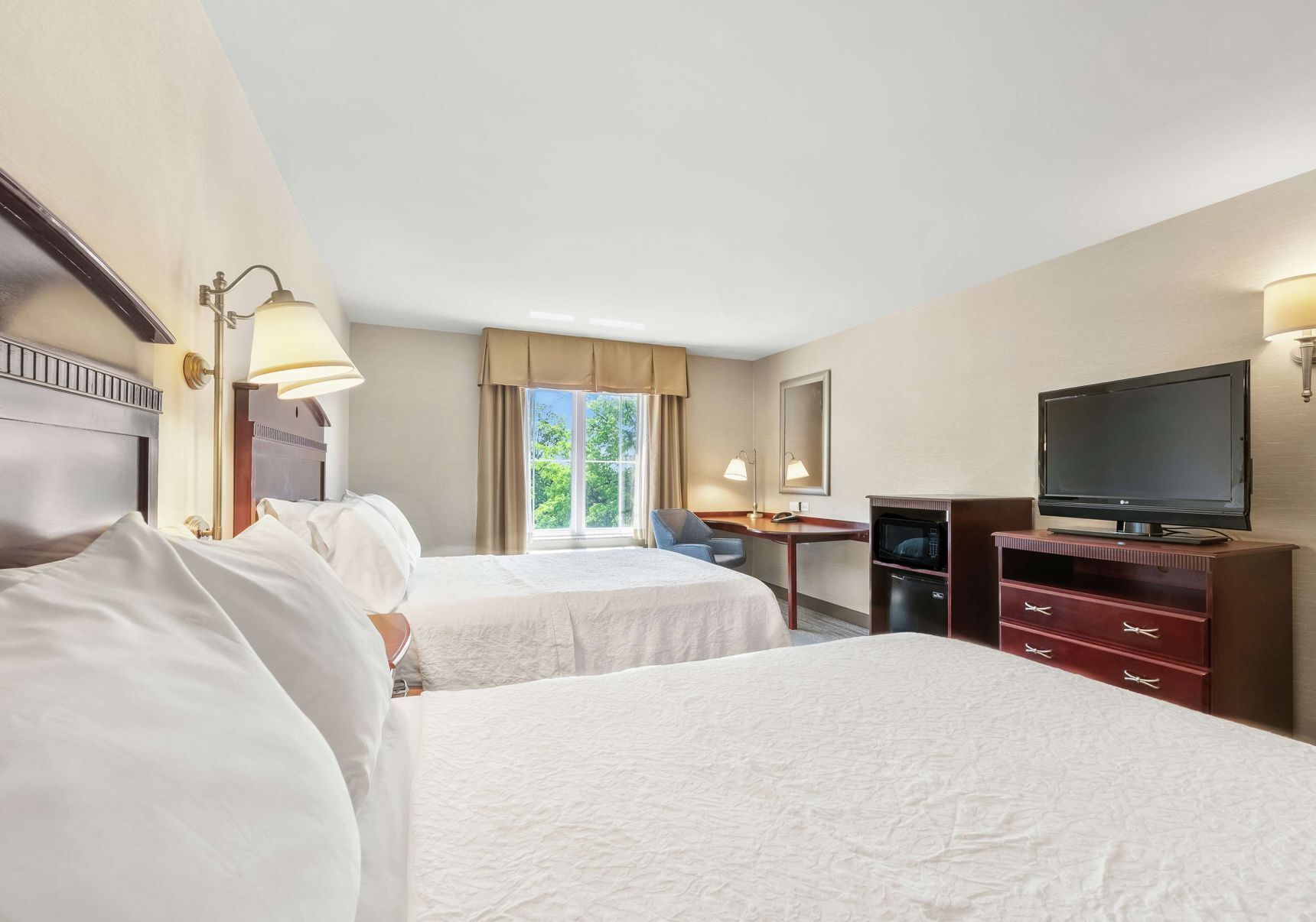 Hypo-allergenic bedding, desk, laptop workspace, blackout curtains