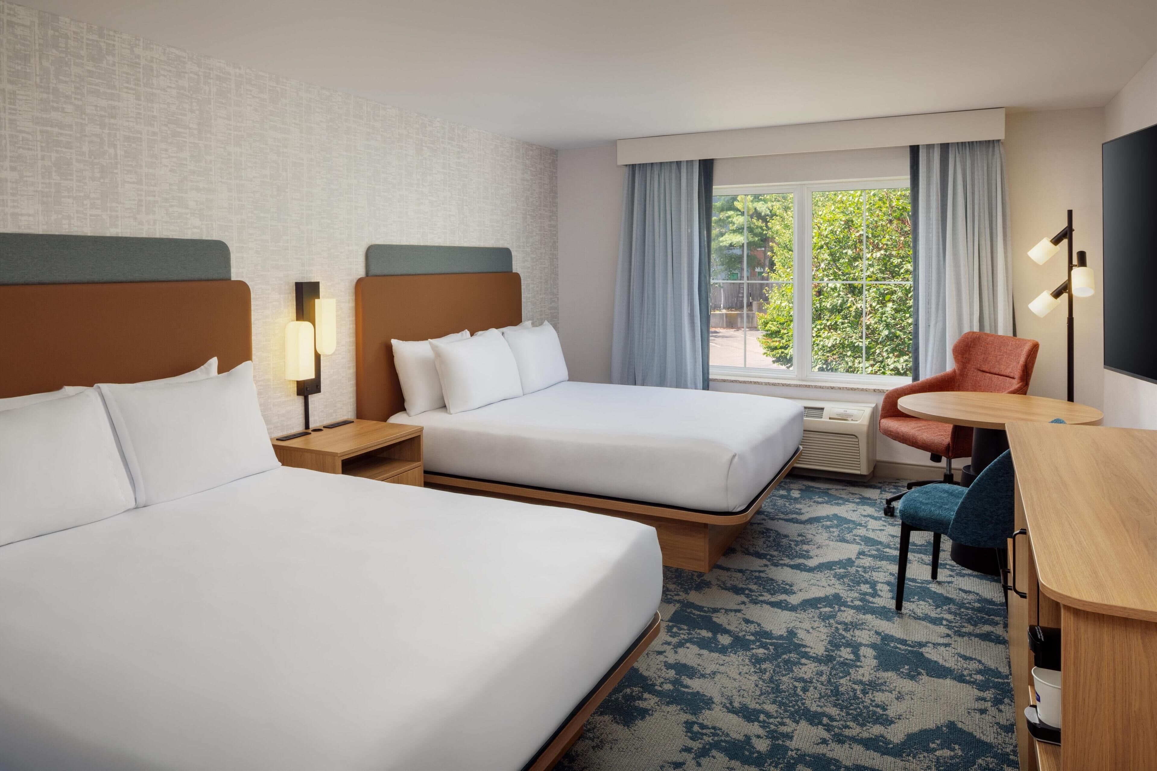 hypo-allergenic bedding, desk, laptop workspace, blackout curtains