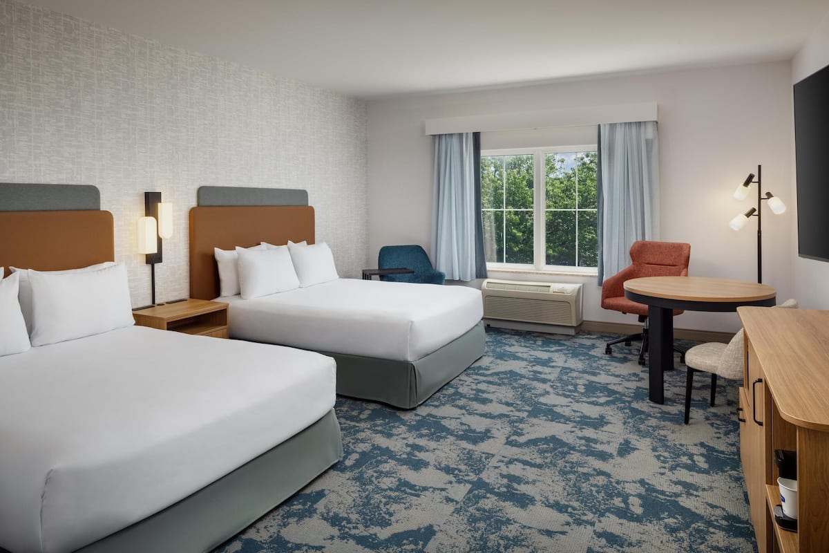 Hypo-allergenic bedding, desk, laptop workspace, blackout curtains