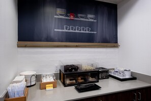 A breakfast area with a chalkboard menu, a toaster, and a display of hard-boiled eggs. - Hampton Inn La Junta (La Junta)