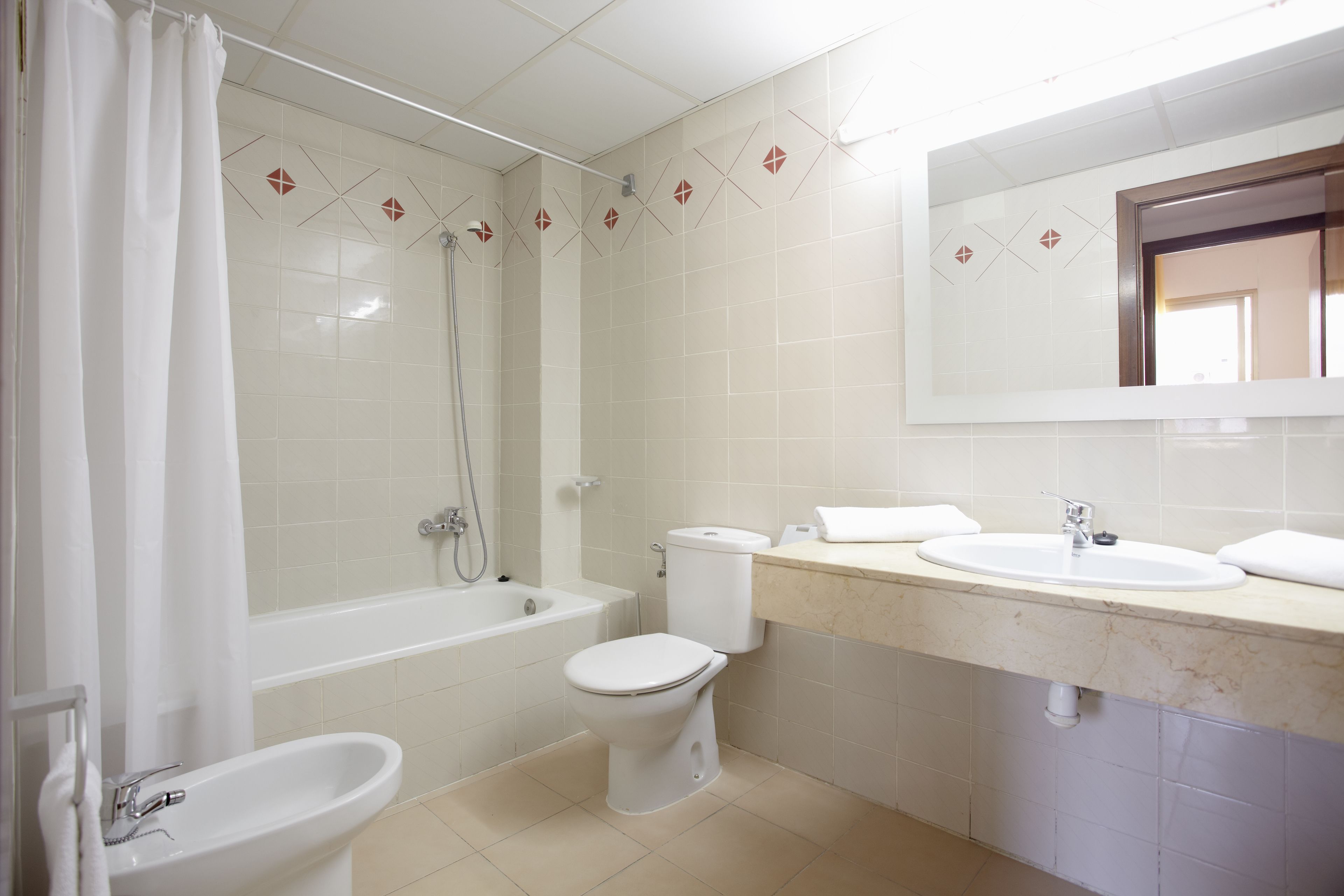 free toiletries, hair dryer, towels, toilet paper