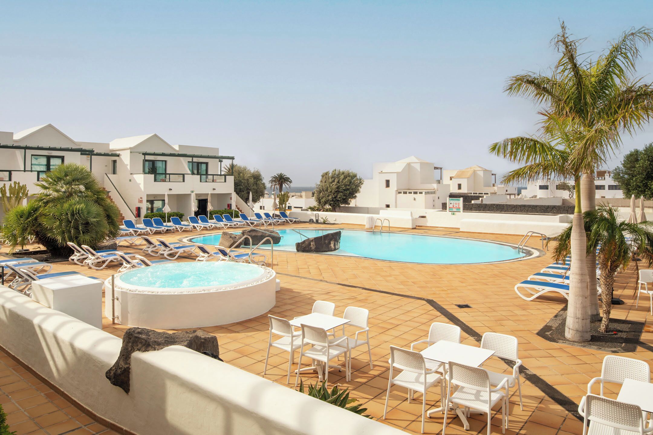 Outdoor pool, a rooftop pool, open 10:00 AM to 6:00 PM, pool umbrellas