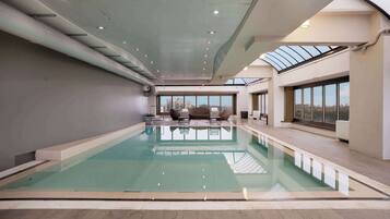 Indoor pool, open 7:00 AM to 9:00 PM, sun loungers