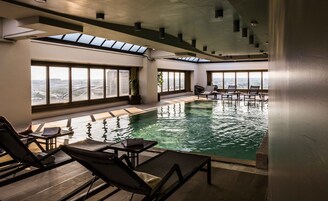 Indoor pool, open 7:00 AM to 9:00 PM, pool loungers