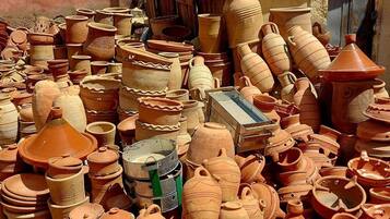 A variety of clay pots and containers piled together.