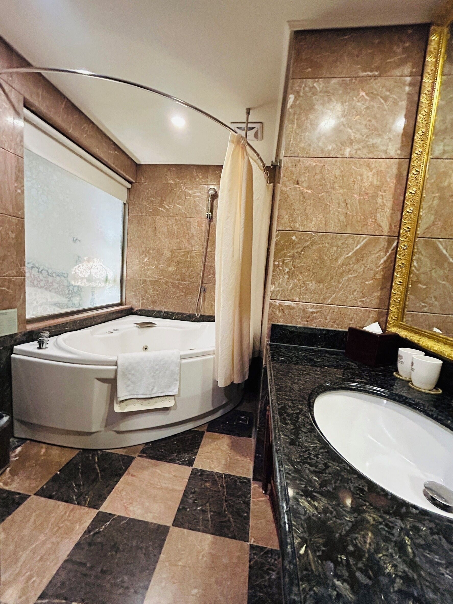 deluxe twin room (classic building) | bathroom | eco-friendly toiletries, hair dryer, slippers, towels