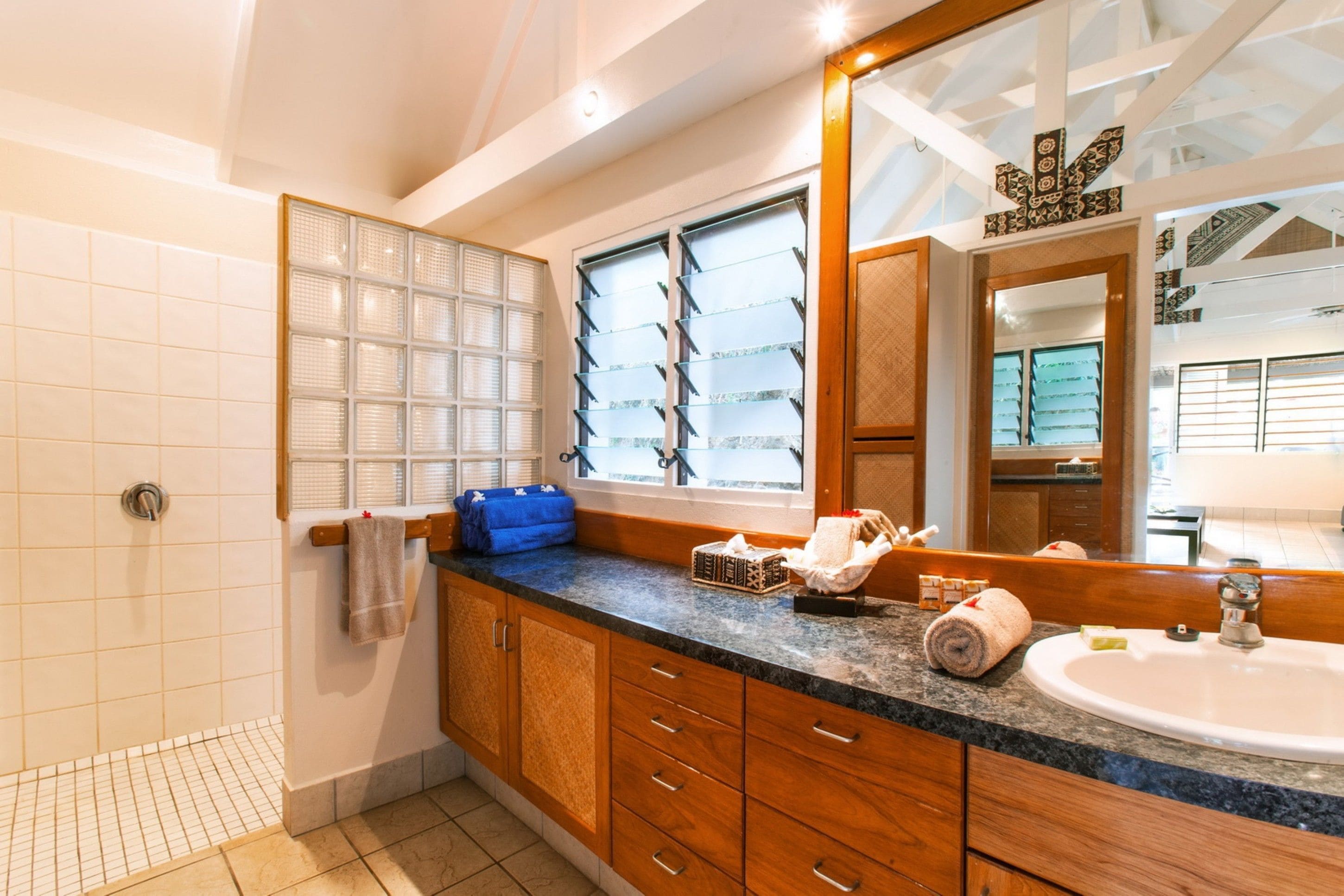 shower, designer toiletries, hair dryer, towels