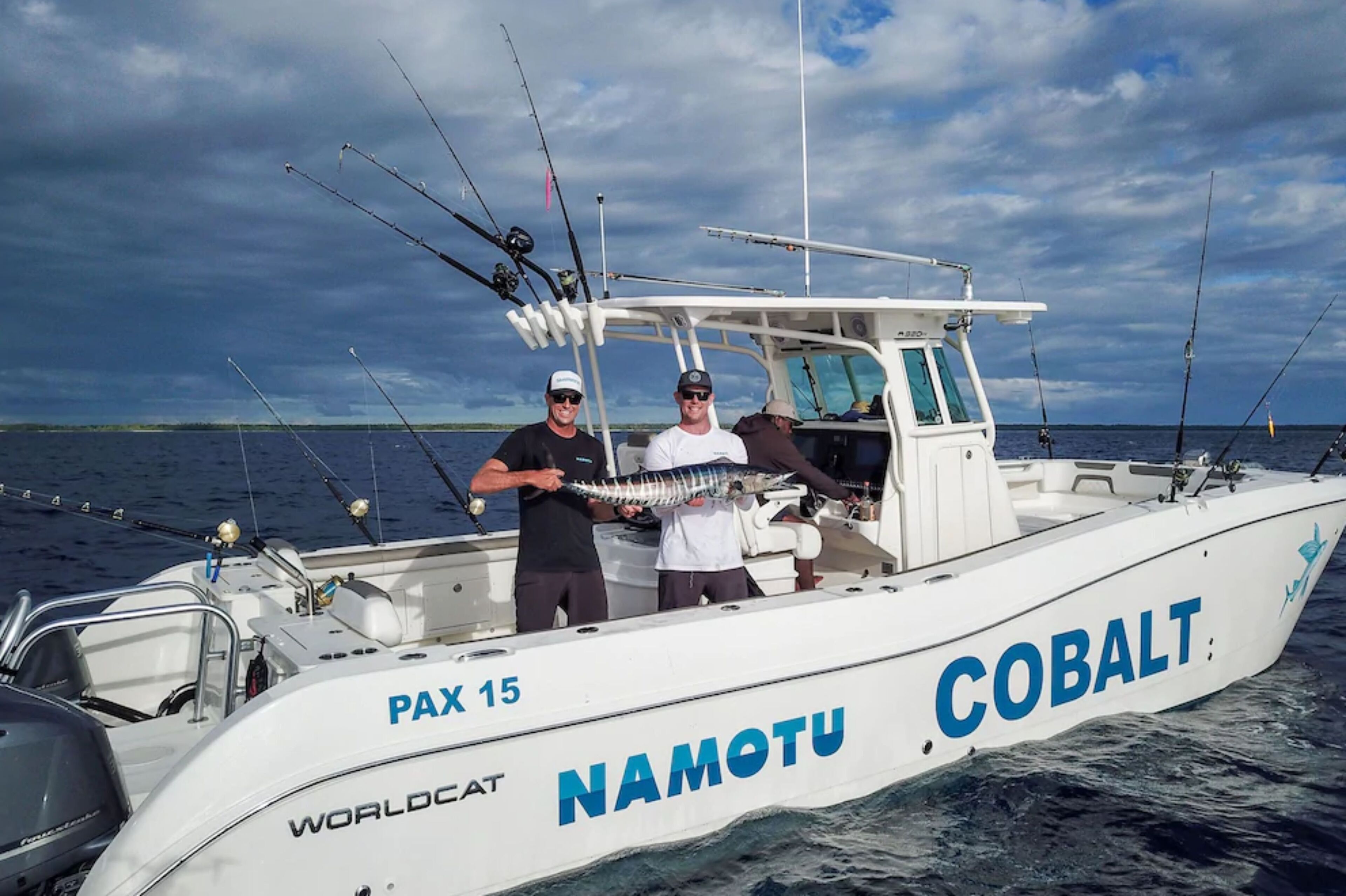 A boat named 'NAMOTU Cobalt' with 'PAX 15' and 'WORLDLOCAT' written on it.