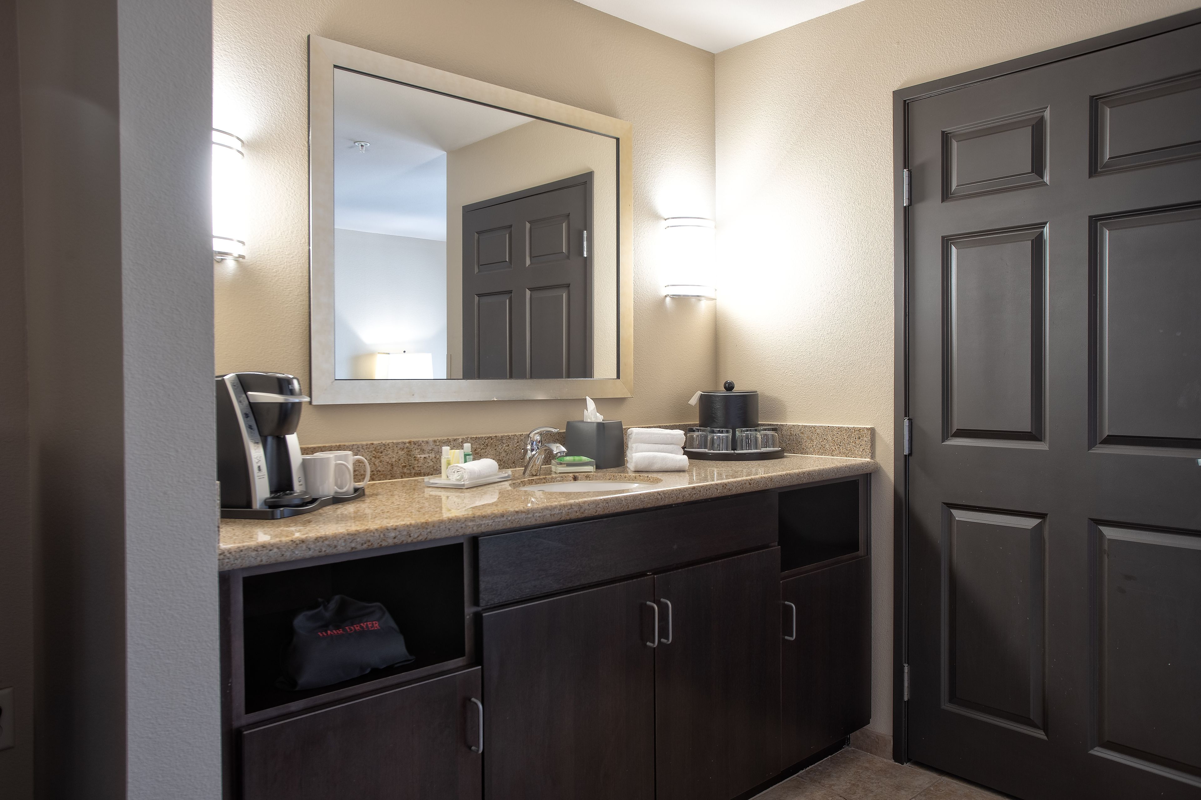 designer toiletries, hair dryer, towels, soap