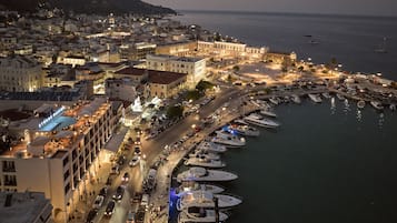 Stroll along the waterfront, where yachts are docked and the town comes alive.