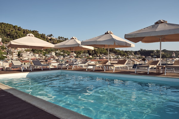 Seasonal outdoor pool, pool umbrellas, pool loungers