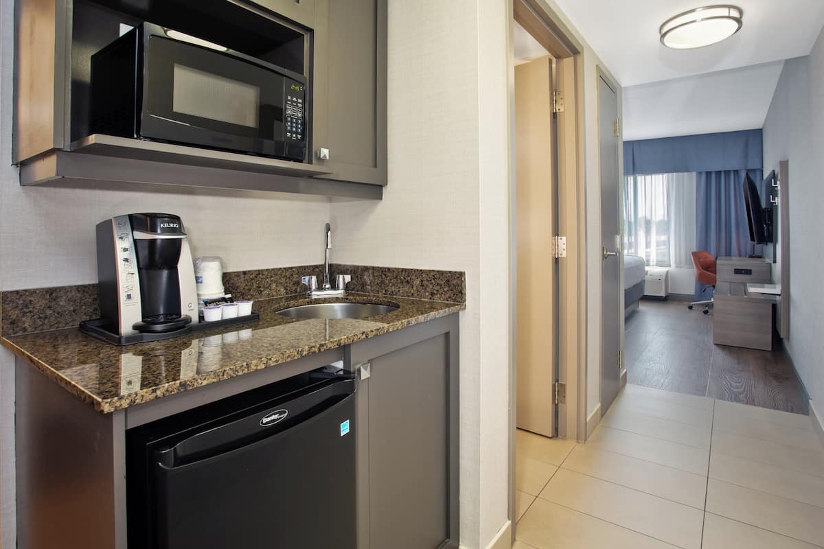 suite, 1 king bed (additional living area) | 1 bedroom, desk, iron/ironing board, rollaway beds