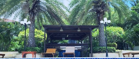 Outdoor pool, open 7:00 AM to 9:00 PM, pool umbrellas, sun loungers