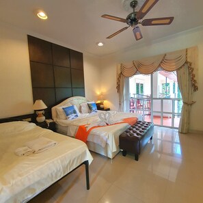 Family Room | Minibar, in-room safe, free WiFi, bed sheets