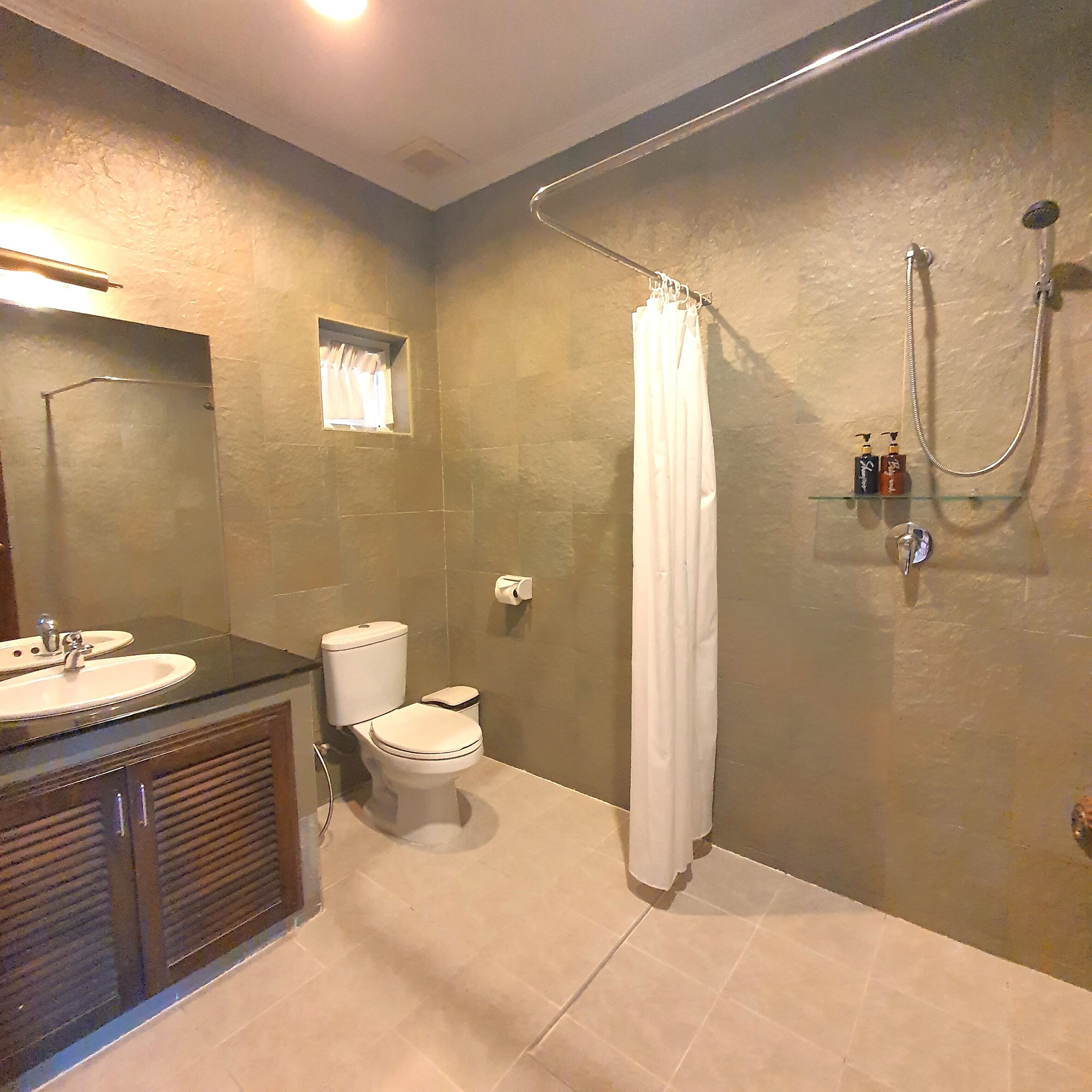 shower, hair dryer, bidet, towels