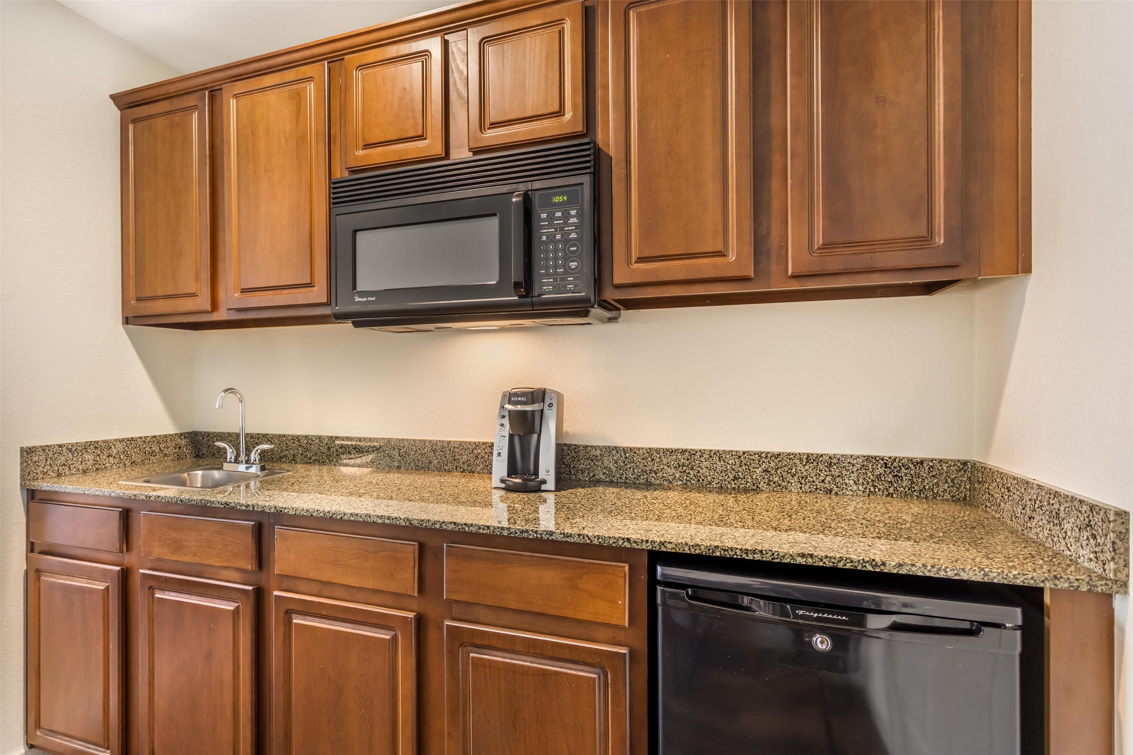 desk, laptop workspace, iron/ironing board, rollaway beds