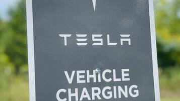 A Tesla vehicle charging sign.