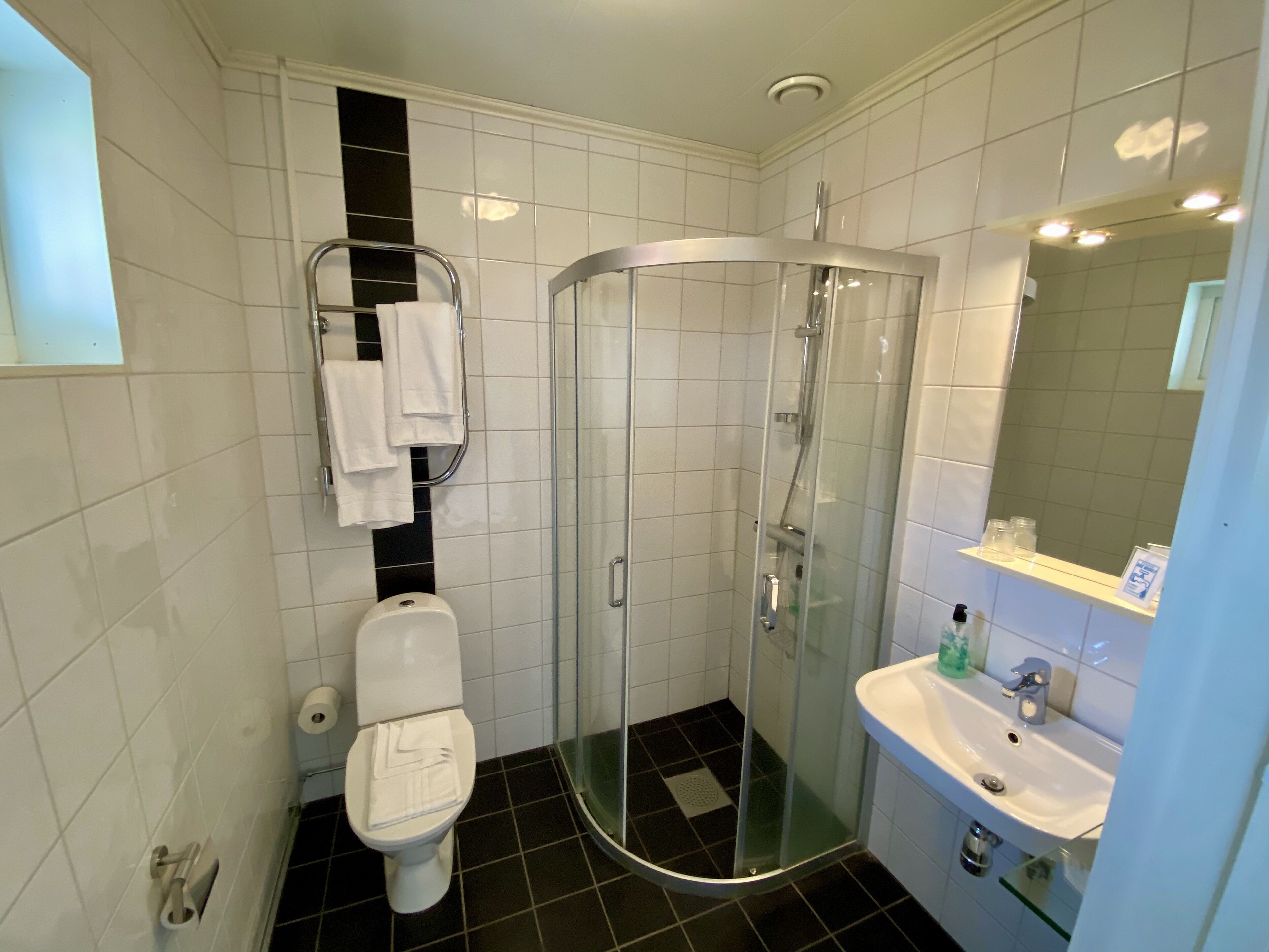 shower, hair dryer, bathrobes, slippers