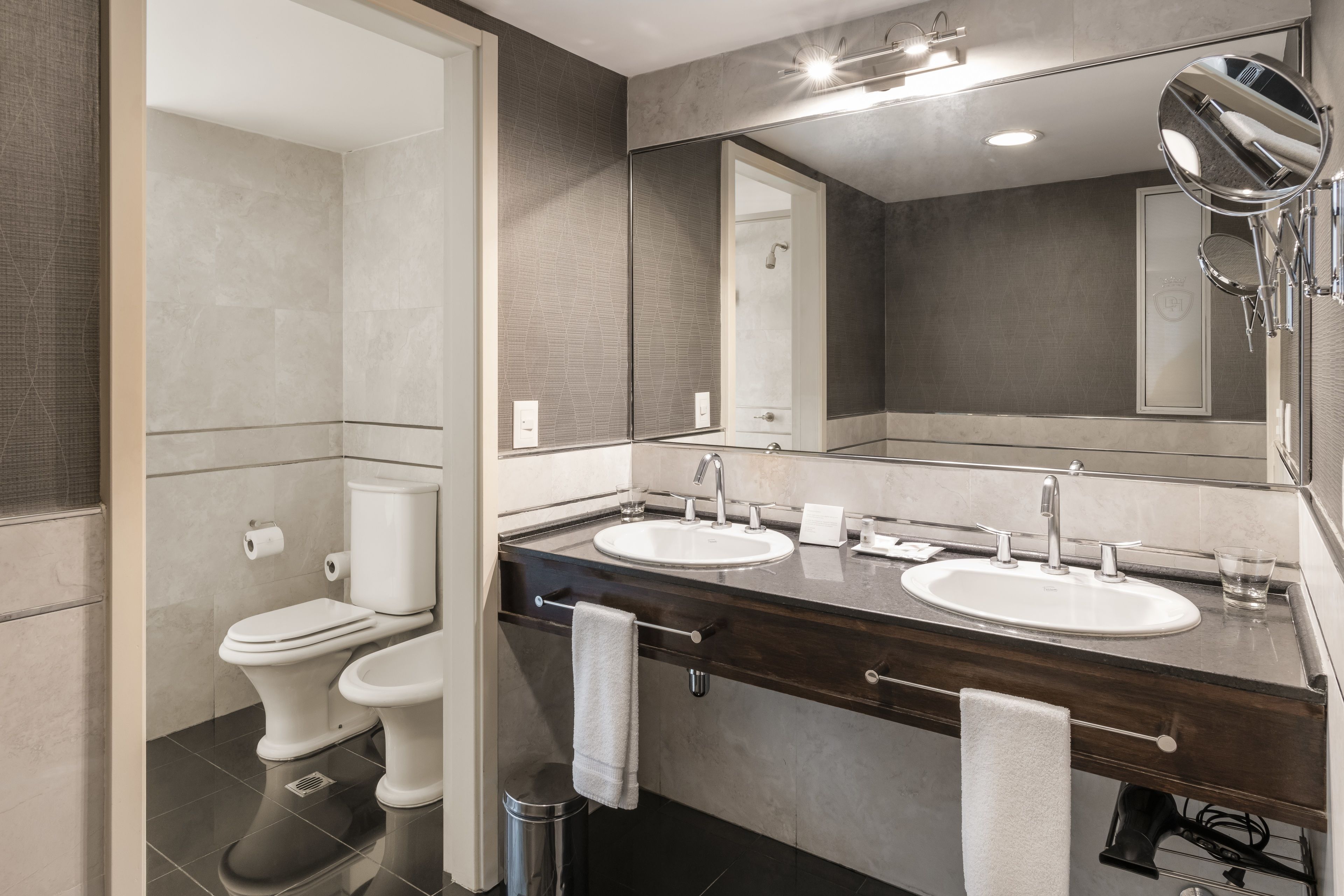 combined shower/bathtub, rainfall showerhead, hair dryer, bidet