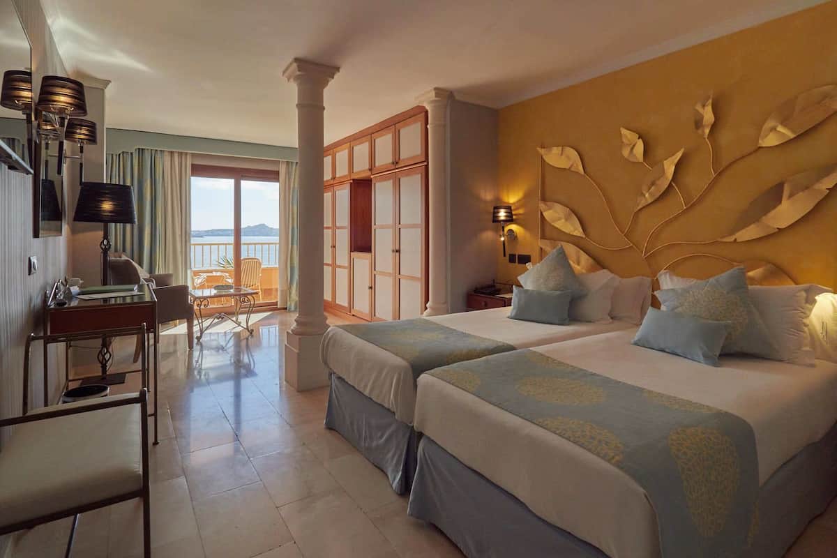 junior suite, sea view | minibar, in-room safe, desk, iron/ironing board