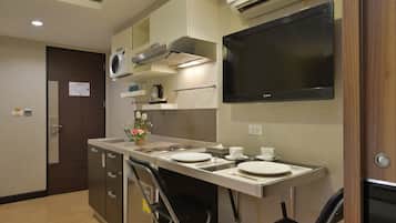 Fridge, microwave, stovetop, coffee/tea maker