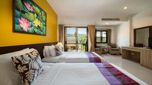A hotel room with two beds, a TV, a desk, and a balcony with a view of the mountains. - Kamala Beachfront Apartment (Kamala)