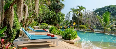 Outdoor pool, open 7:00 AM to 7:00 PM, pool umbrellas