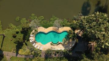 Outdoor pool, open 7:00 AM to 7:00 PM, pool umbrellas