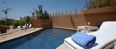 Seasonal outdoor pool, open 9:00 AM to 9:00 PM, sun loungers