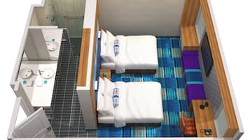 A hotel room with two beds, a bathroom, a small desk, and a TV.