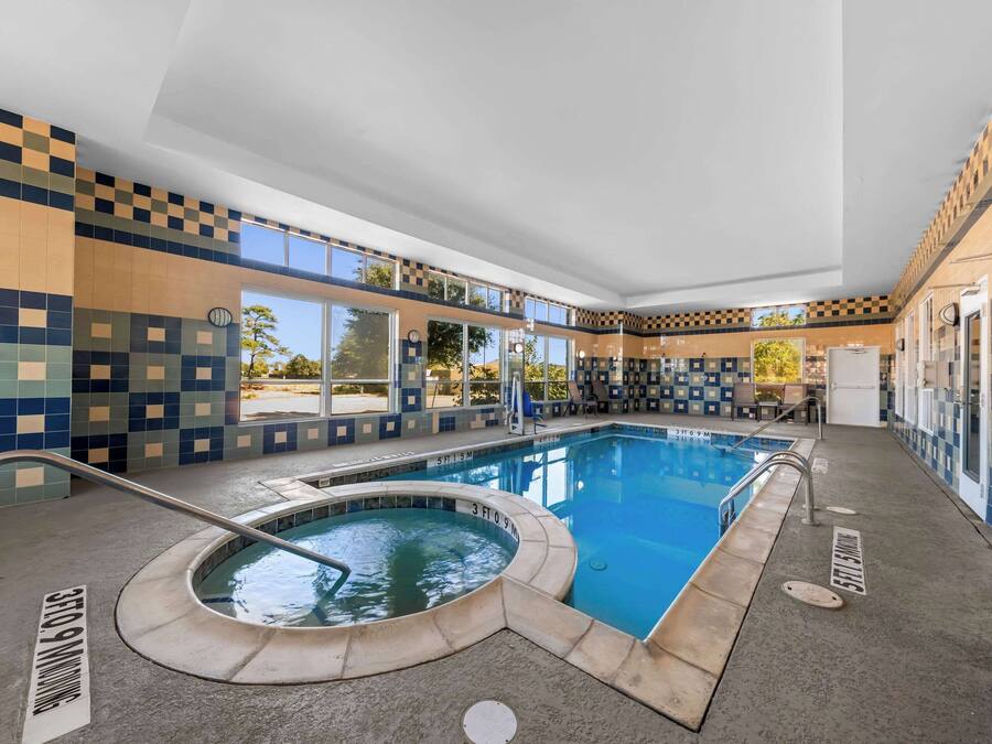 Indoor pool, open 7:00 AM to 11:00 PM, pool umbrellas, sun loungers