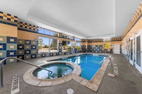 Indoor pool, open 7:00 AM to 11:00 PM, pool umbrellas, pool loungers. Comfort Inn & Suites Near Lake Lewisville