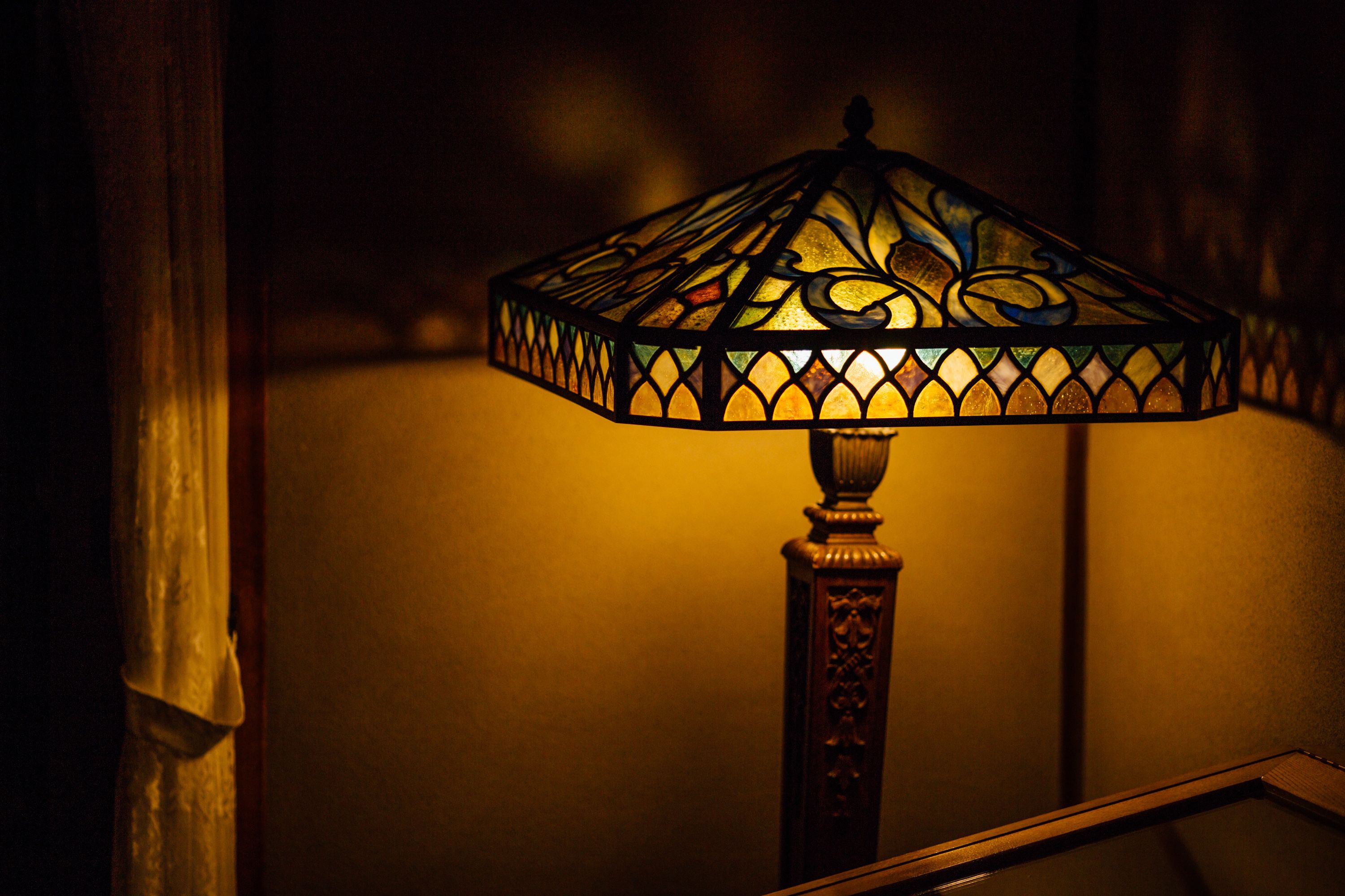A lamp with a stained glass shade.