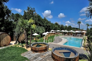 Seasonal outdoor pool, open 9:30 AM to 7:30 PM, pool umbrellas