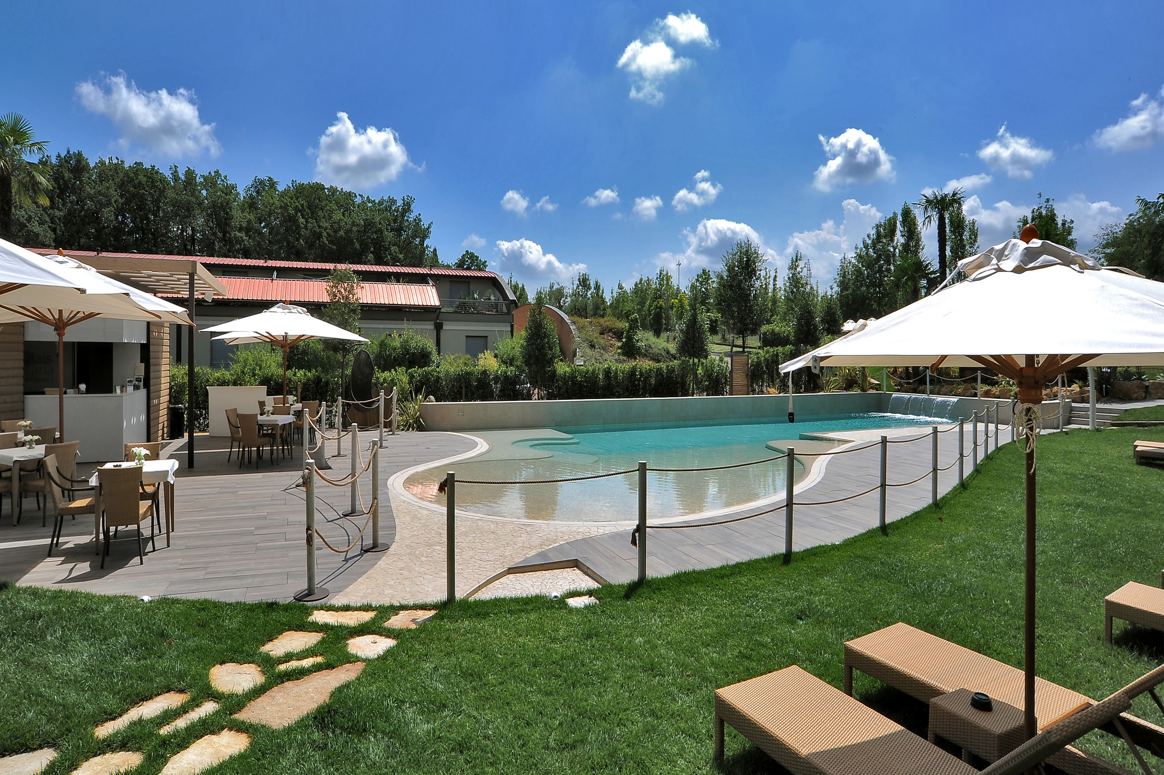 seasonal outdoor pool, open 9:30 am to 7:30 pm, pool umbrellas