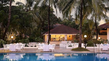 Outdoor pool, open 7 AM to 7 PM, pool umbrellas, pool loungers