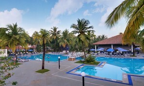 Outdoor pool, open 7 AM to 7 PM, pool umbrellas, pool loungers