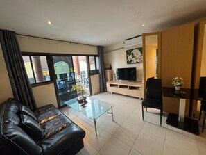 City Apartment, 1 Bedroom | Living area | 32-inch LED TV with cable channels, DVD player - Aquarius Gay Guesthouse & Sauna (Patong)