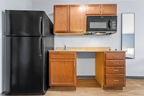 Full-size fridge, microwave, stovetop, freezer