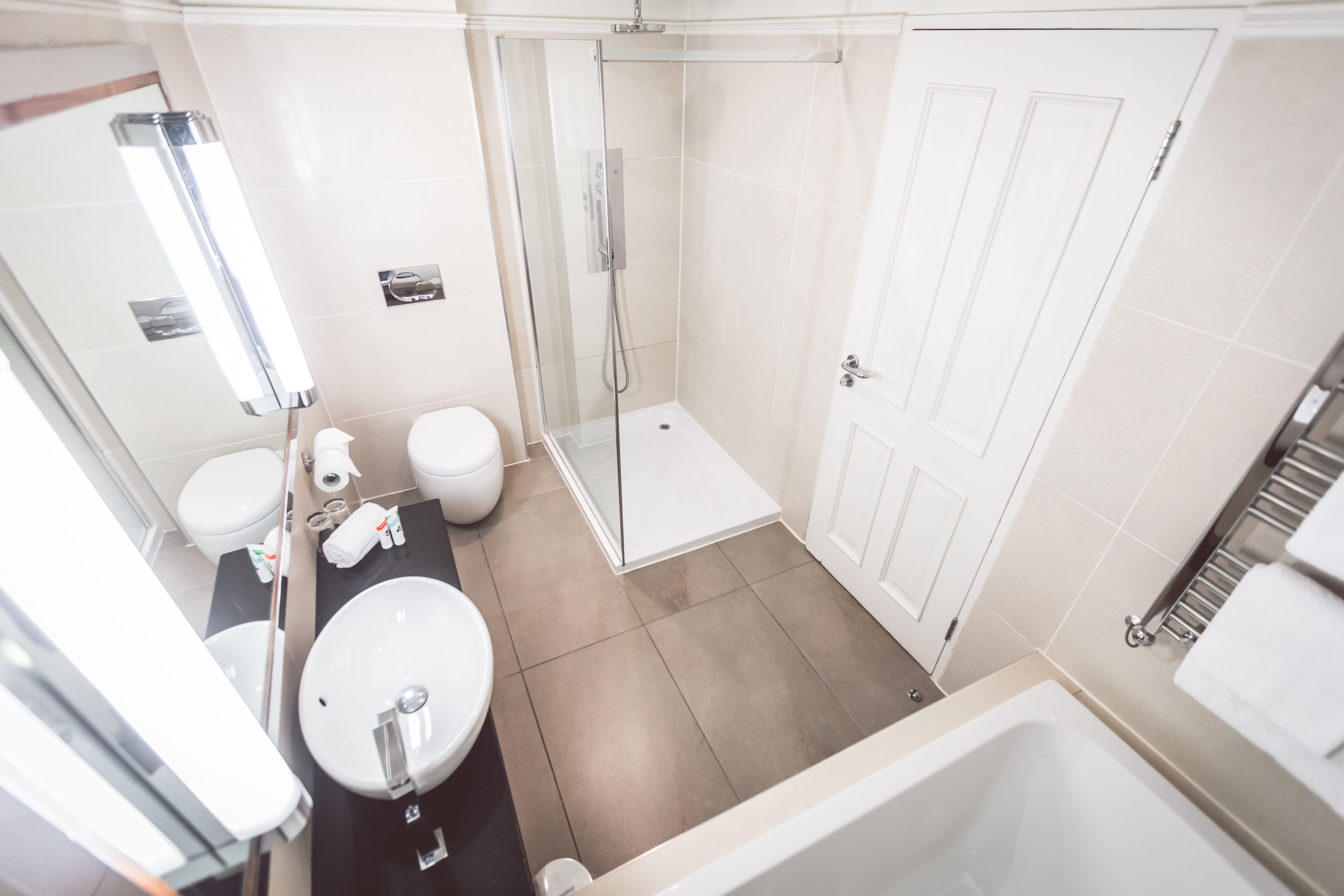 Standard Double Room | Bathroom | Rainfall showerhead, designer toiletries, hair dryer, towels