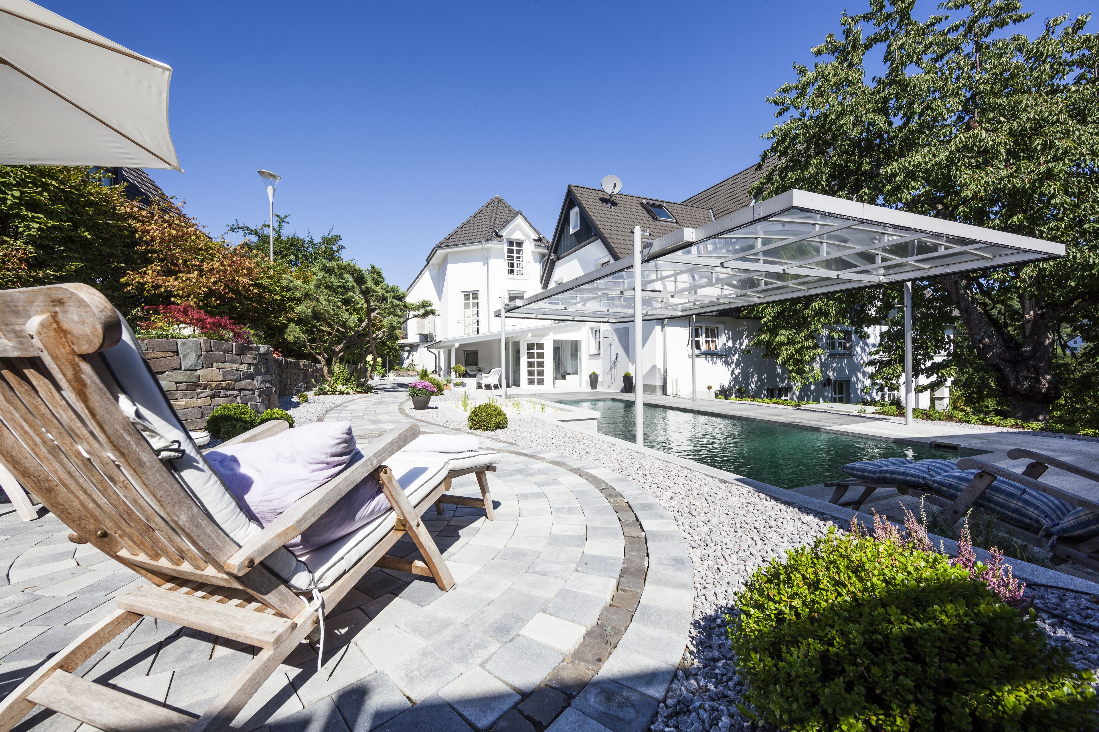 seasonal outdoor pool, pool umbrellas, pool loungers