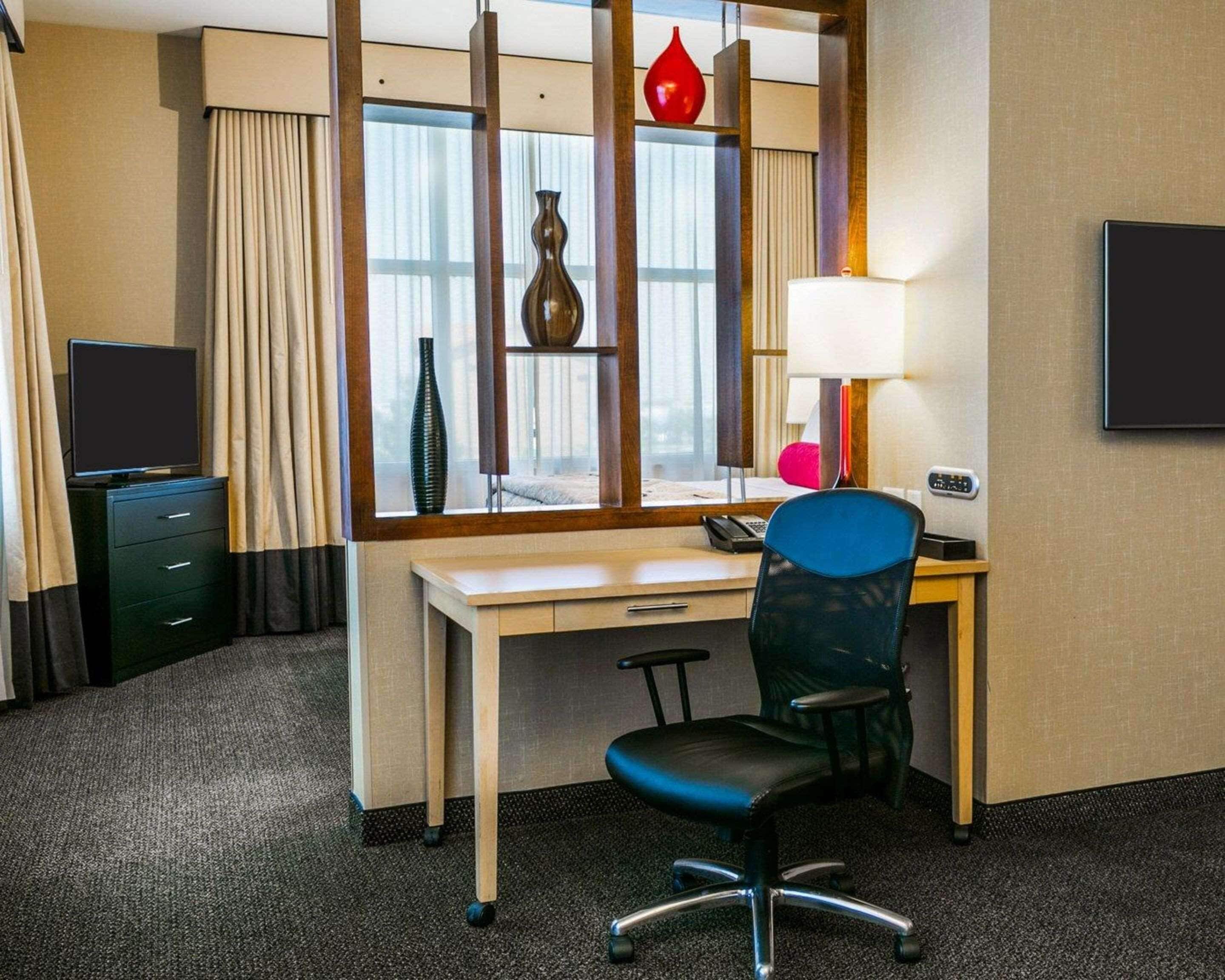 premium bedding, desk, blackout curtains, iron/ironing board